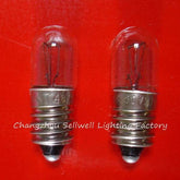 two small instruments bulb screw E10 lamp holders on red background