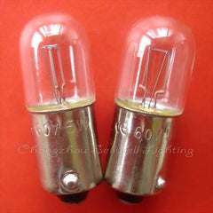 Two Ba9s lamp holders signal instrument light bulbs with metal bases and clear glass on red background