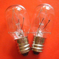 Two clear E12 instrument bulbs with metal screw bases on an orange background