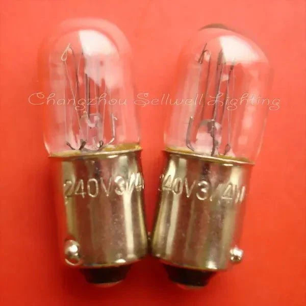 Two miniature lamps 240v 3/4w ba9s base on red background