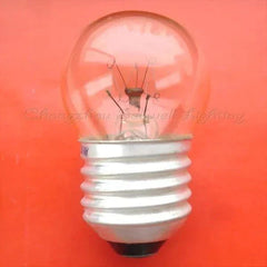 Miniature bulb 120v 15w E26 base clear glass light bulb on orange background
