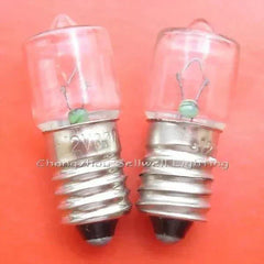 Close-up of two 12v 0.7a E10 miniature light bulbs on an orange background