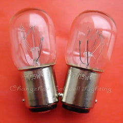 Two 220V 15W miniature lamps with BA15d base on orange background