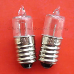 Close-up of two 6V 0.5A E10 halogen light bulbs on red background
