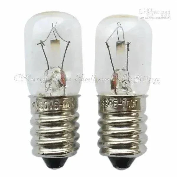 Two clear glass miniature lamps lighting with E14 base and metal screw fittings, 24/30V, 6/10W power bulbs A368 model.