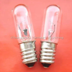 Two 12V 15W E14 miniature light indicator bulbs with clear glass and metal base on orange background