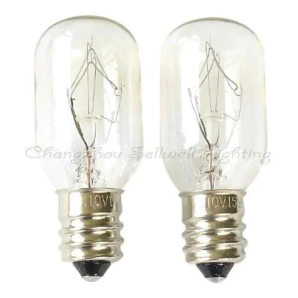 Two clear miniature 110v 15w E12 base incandescent light bulbs with visible filaments
