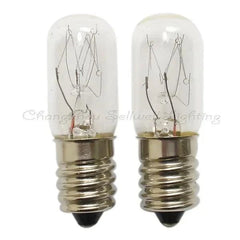 Close-up of two E14/E12 base miniature light bulbs T16x48 220V with clear glass and visible filaments