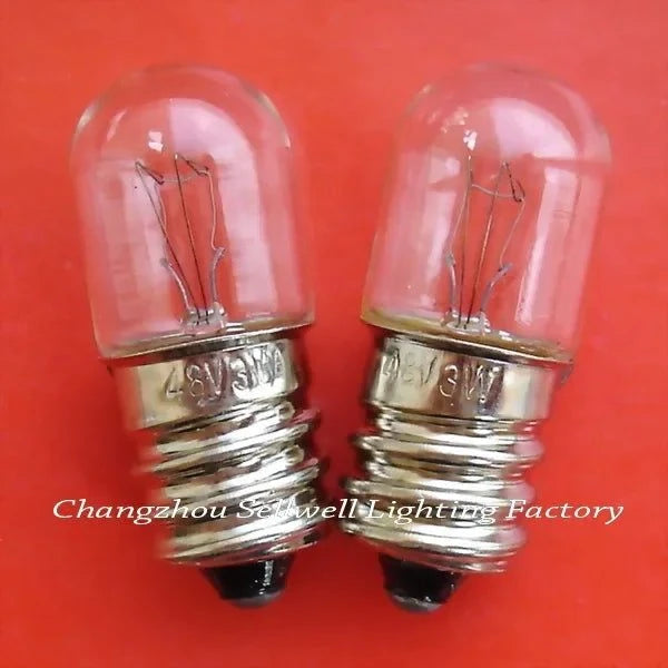 Two miniature 48V 3W E12 base lamps with clear glass bulbs on a red background