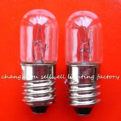 Two miniature 10V 2W E10 base incandescent lamps on red background