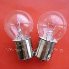 Miniature light 6V 15W BA15S G25 clear glass bulb with metal base set against red background