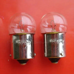 10pcs miniature lamps 12v 10w ba15s g18 A493 with clear glass bulbs and metal bases on red background