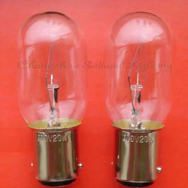 Two miniature lamps 110v 20w Ba15d base indicator bulbs on red background