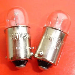 Two miniature light bulbs 30V 2W BA9S T10x24 with metal bases on red background