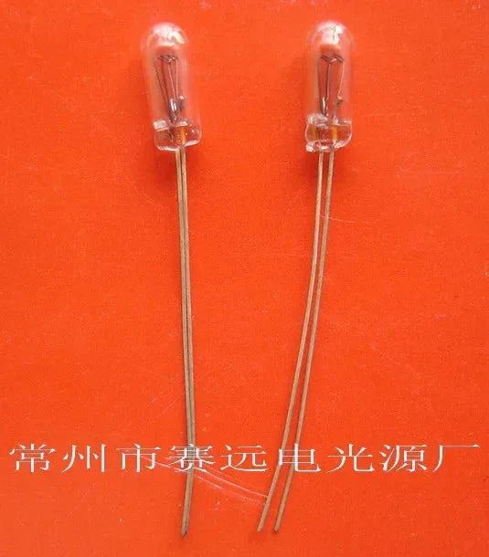 Miniature lamp 24V 0.05A 3x8x25mm two pieces on orange background