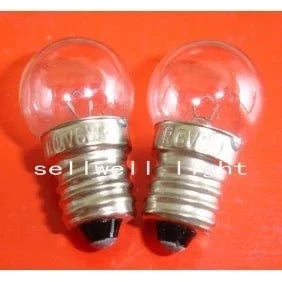 Two 6V 6W E10 base Krypton light bulbs with clear glass on an orange background