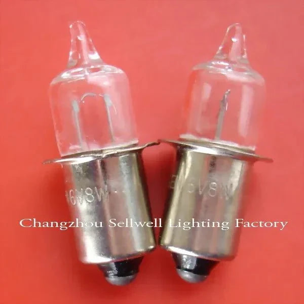 Pair of 6V 8W halogen lamps with P13.5S base on red background