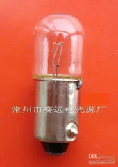 Miniature lamp ba9s t10x28 28v 3w with metal base and glass bulb on orange background