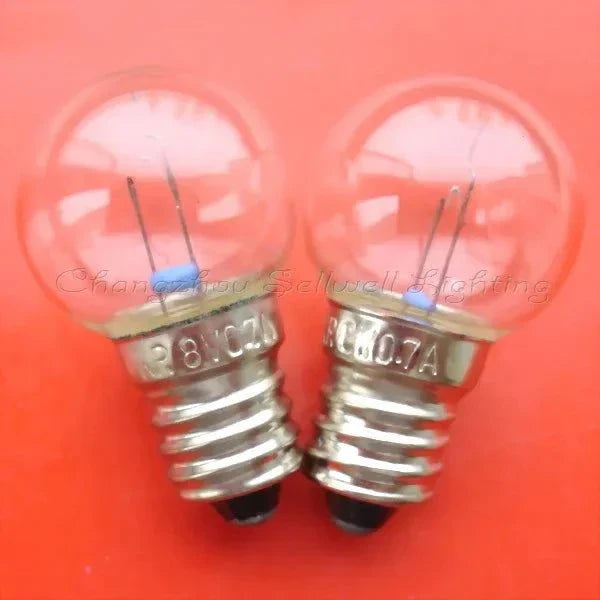 Pair of 8V 0.7A miniature E10S base light bulbs with 18mm diameter
