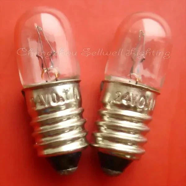 Two 24V 0.11A E10 miniature lamps with clear glass bulbs and metal screw bases on red background