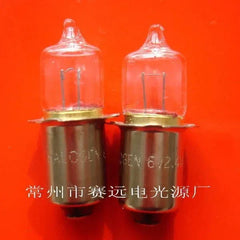 Close-up of two 6V 2.4W P13.5S halogen bulbs lamp on red background