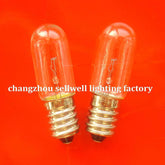 Two E14 transparent spiral old screw indicator bulbs on orange background