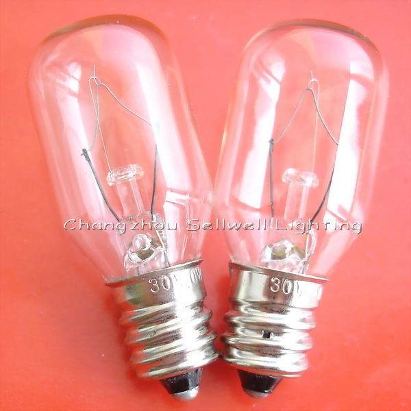 Two clear E12 screw base instrument indicator light bulbs on a red background
