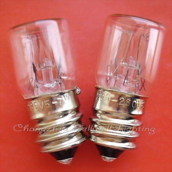 E14 transparent spiral old screw indicator bulbs with clear glass and metal base on red background
