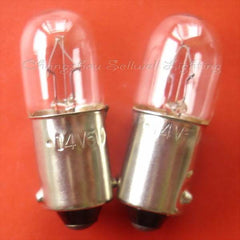 Two Ba9s lamp holders light bulbs with clear glass and metal bases on orange background