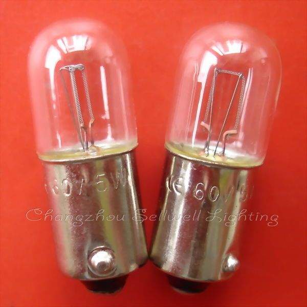 Two Ba9s lamp holders signal instrument light bulbs with metal bases and clear glass on red background