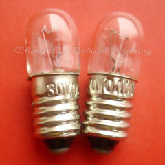 Two small instruments bulb screw E10 type lamp holders with metal screw bases on red background