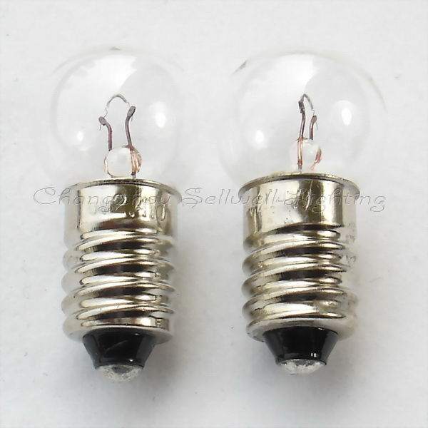 Two small E10 screw base instrument bulbs with clear glass tops and metal threaded bases for low voltage applications.