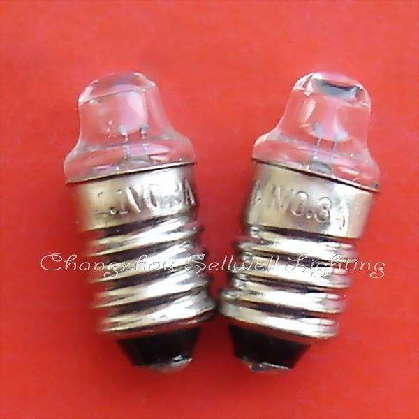Two small instruments bulb screw E10 lamp holders on a red background
