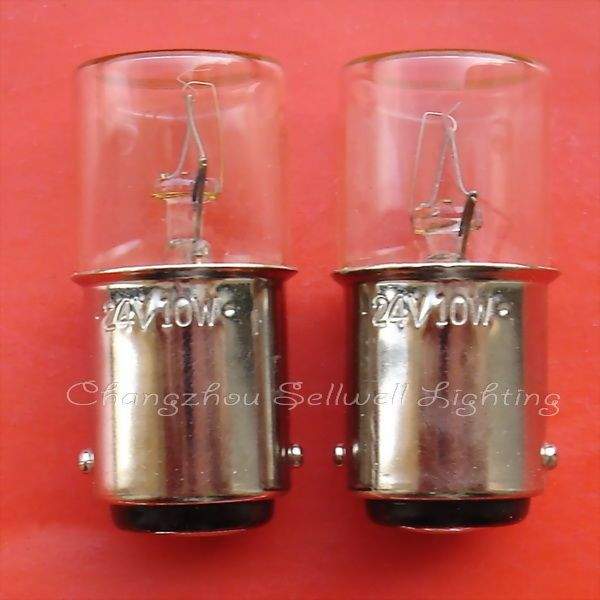Close-up of two 24V 10W double-point bayonet lamp holders with clear glass bulbs on a red background