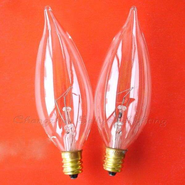 Pair of clear E12 screw base candle flame bulbs on an orange background for instrument and indicator lighting.