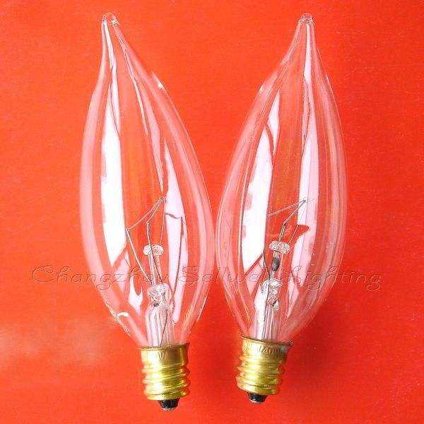 Two clear E12 instrument bulbs with screw bases on an orange background