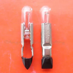Miniature bulb telephone 24v 50ma with metal base and glass top on orange background