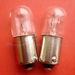 12V 3W Ba9s miniature light bulbs with clear glass and metal base on red background
