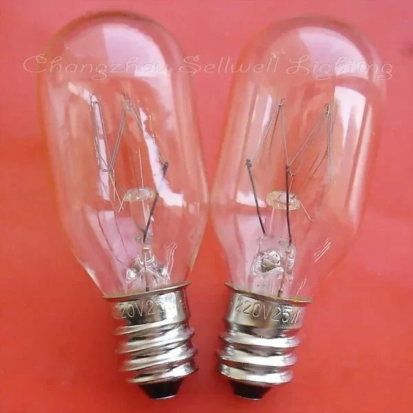 Two miniature 220v 25w E12 incandescent light bulbs on a red background