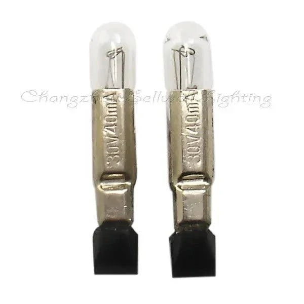 Two 30V 40mA T5x22 miniature lights with clear glass bulbs and metal bases