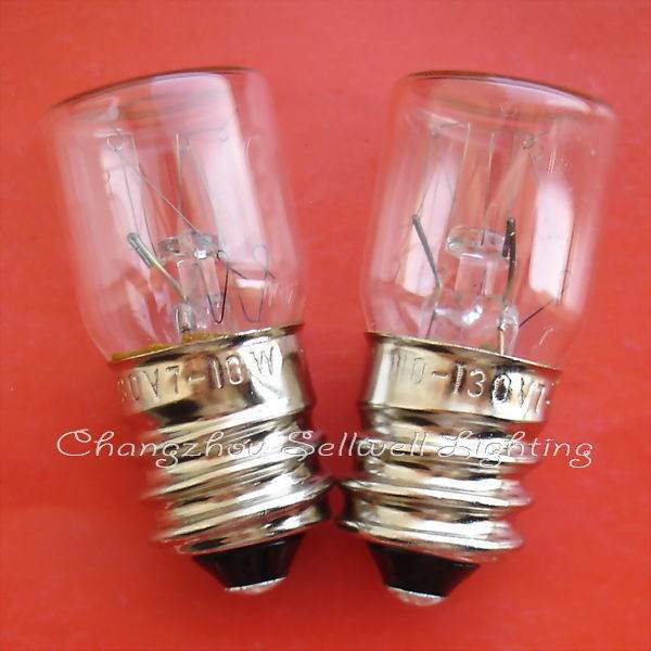 Pair of E14 transparent spiral old screw indicator bulbs on red background